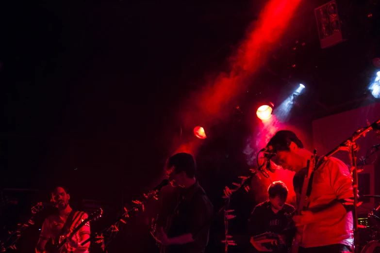 a group of people in front of some bright lights