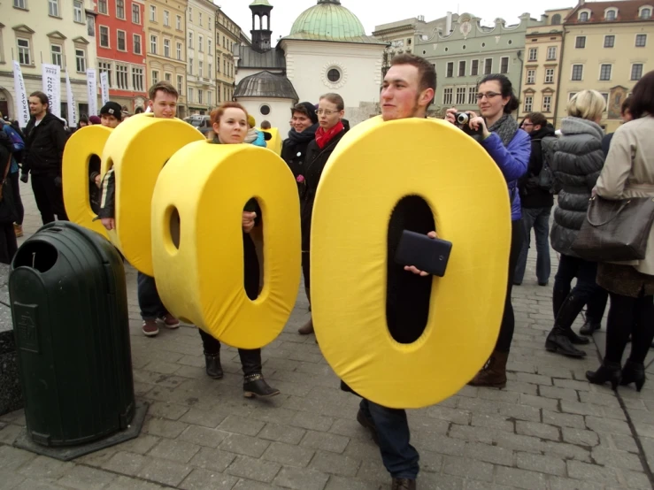 a man in a yellow suit is holding the words boo