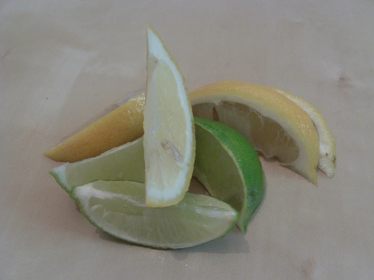 sliced lemons on a surface, one lemon in the center, and the other half eaten