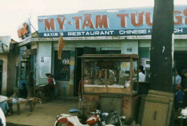 a restaurant with motorcycles parked outside of it