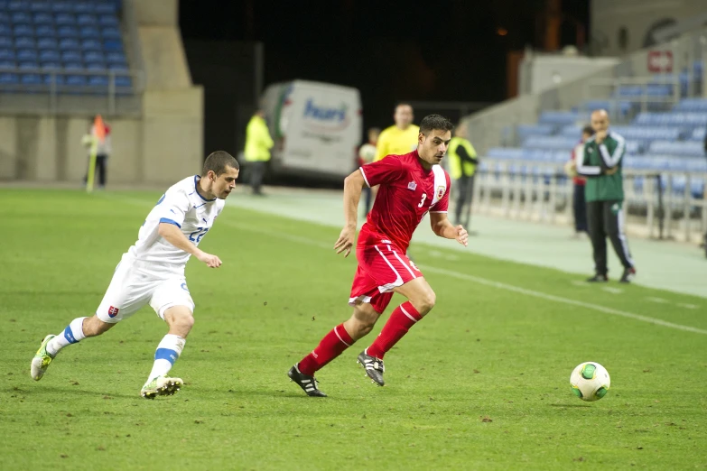 a group of soccer players playing a game