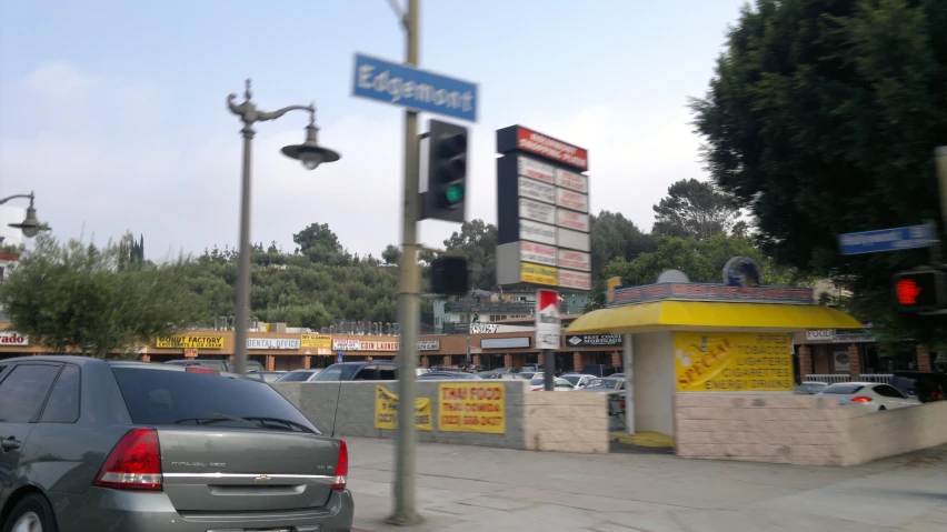 a parking lot with parked cars and a traffic light