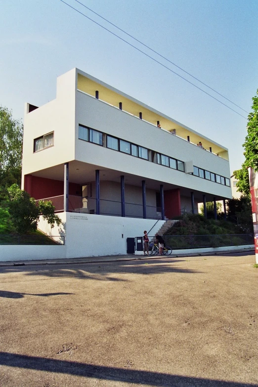 the building has many windows on it and multiple doors