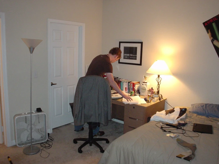 a man working on soing in his room