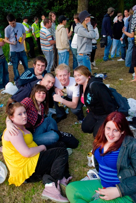 a group of young people sitting around each other