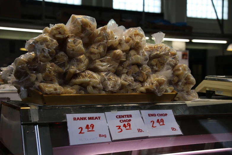 the chicken wrapped in plastic sits on display