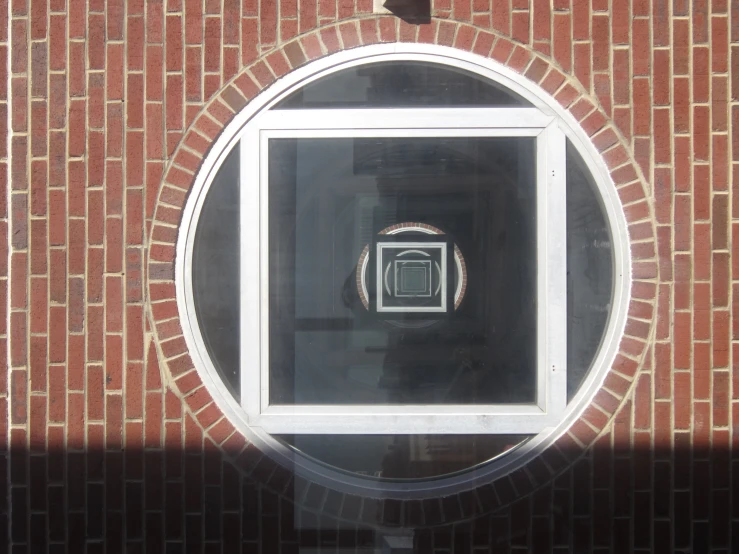 a window has a square reflection in it