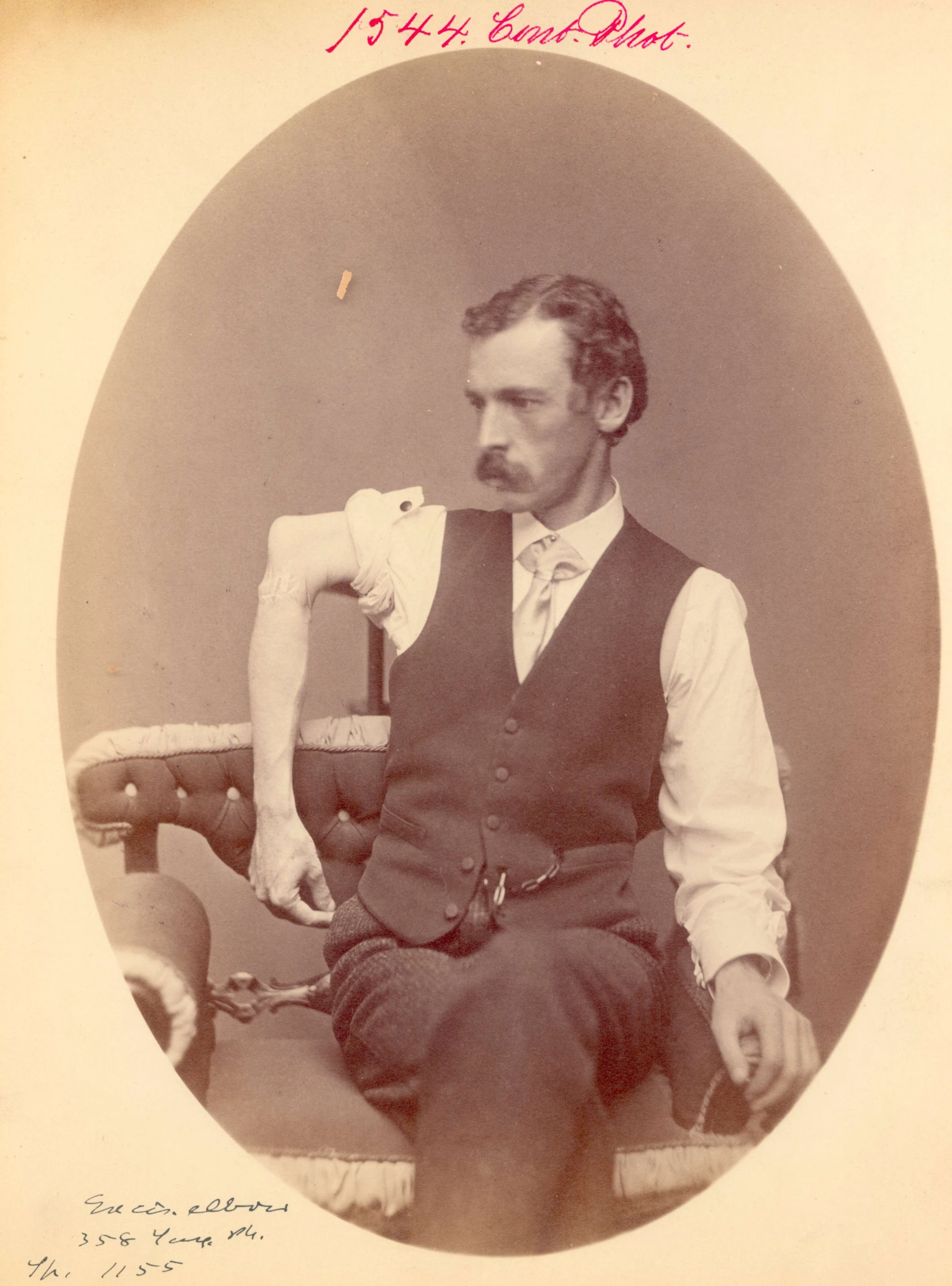 an old po of a man wearing a vest