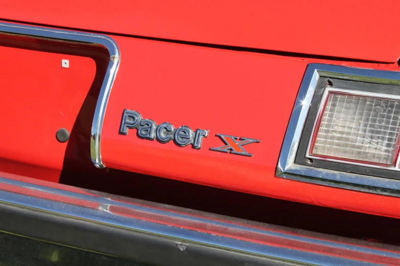 a red and chrome car that says pager