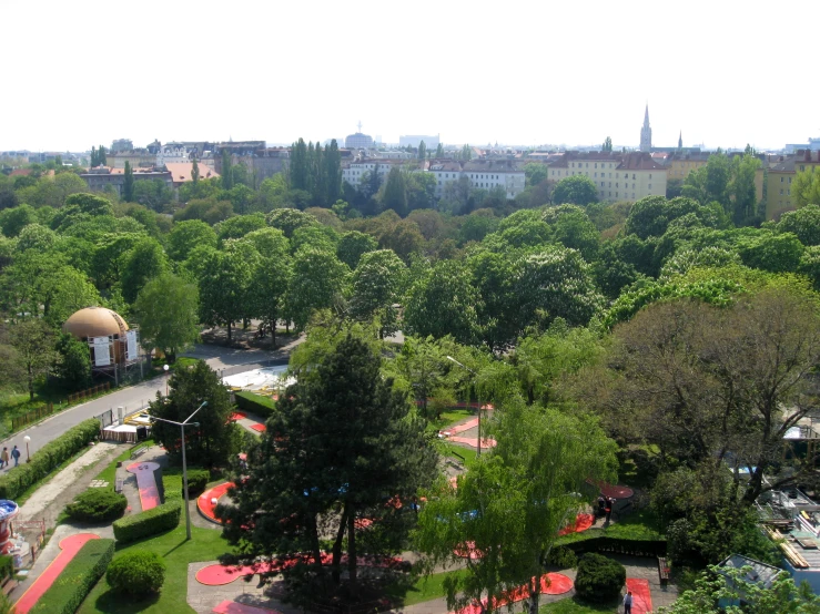 a small park surrounded by trees and plants