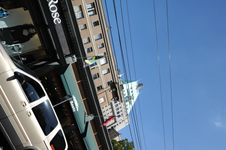 an suv parked in front of a small restaurant