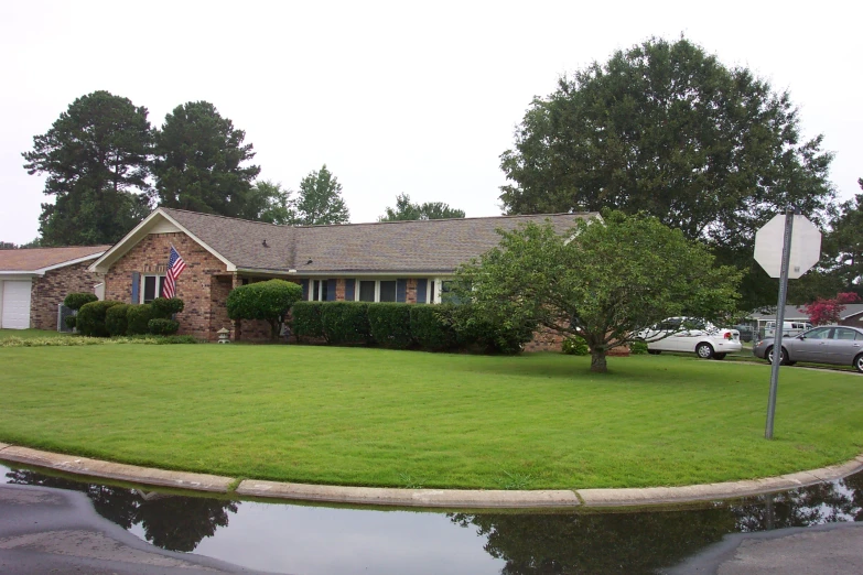 a home with cars parked outside of it