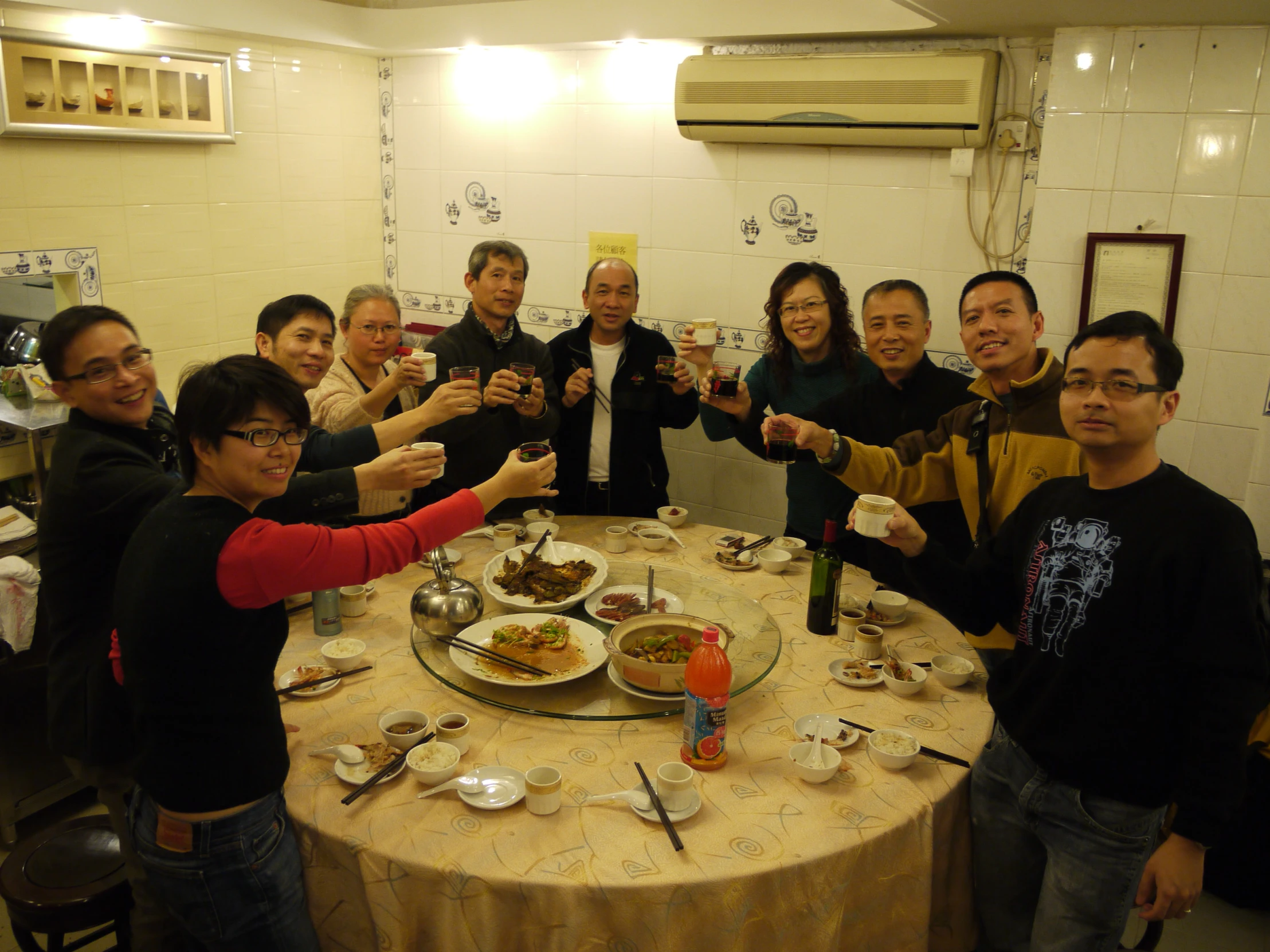 a group of people taking pictures of some food