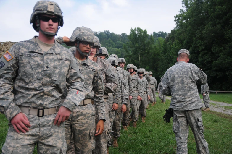 a group of soldiers stand in line, ready for a po