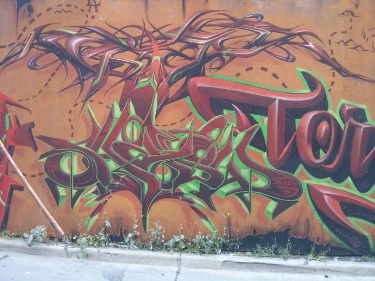 graffiti is spray painted on the side of a wall