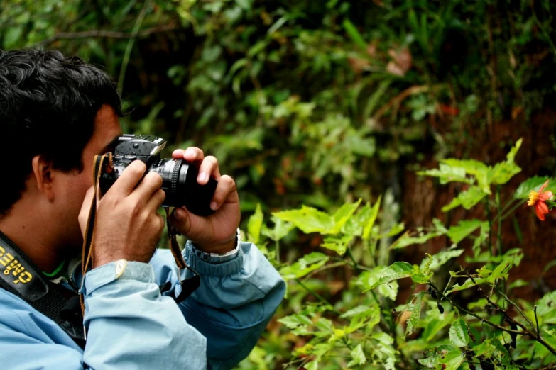 a man is taking a picture with a camera