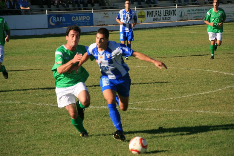 two teams compete during a game of soccer