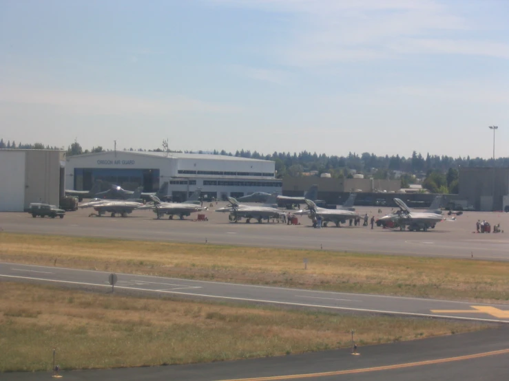 several airplanes are parked in front of an airport terminal