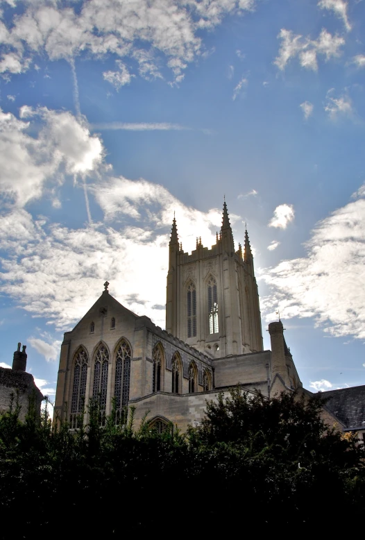 a large church has a sky full of clouds