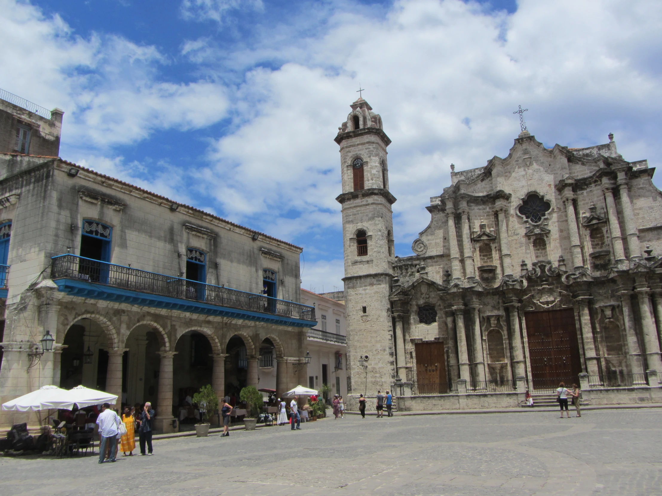 the courtyard of an old building with two clock tower