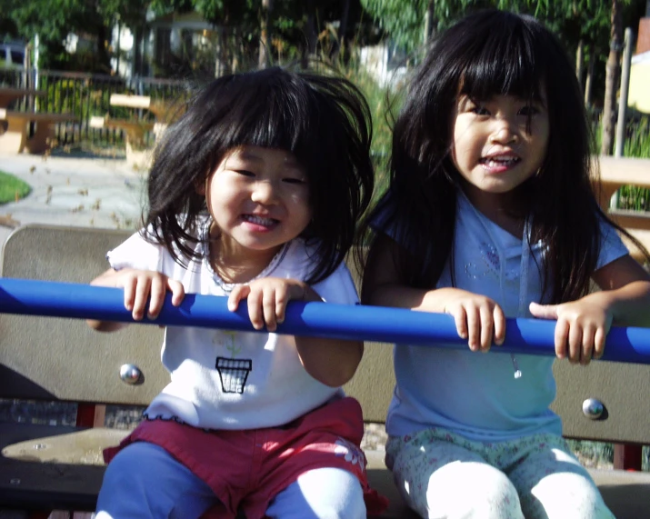 two s playing on the playground