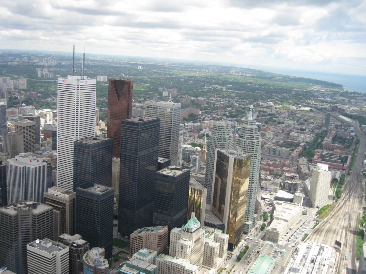 a picture taken from an air plane of tall buildings in a city