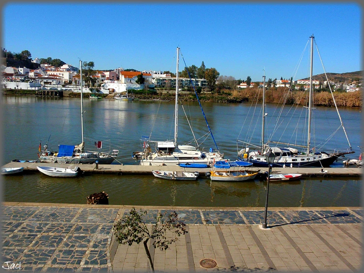 several boats sit parked next to each other