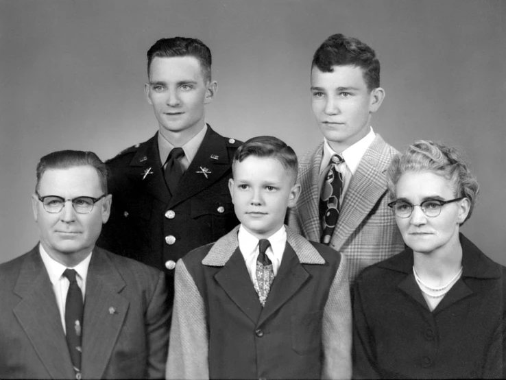 an old black and white po of people in uniform