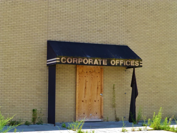 a business front entrance with the name corporate office