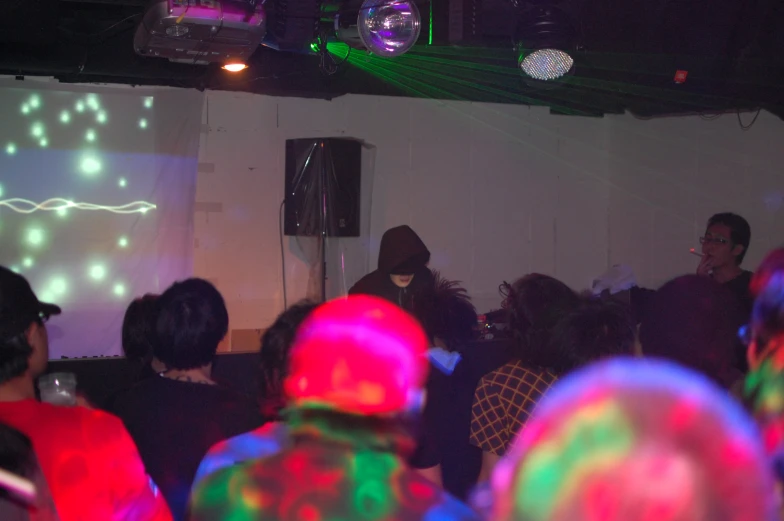 the audience watches the screen as two dancers play