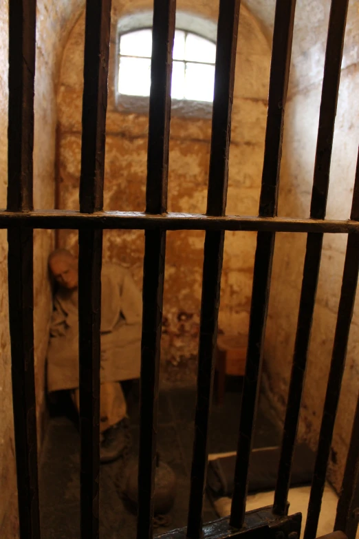 a  cell with bars in the front and back