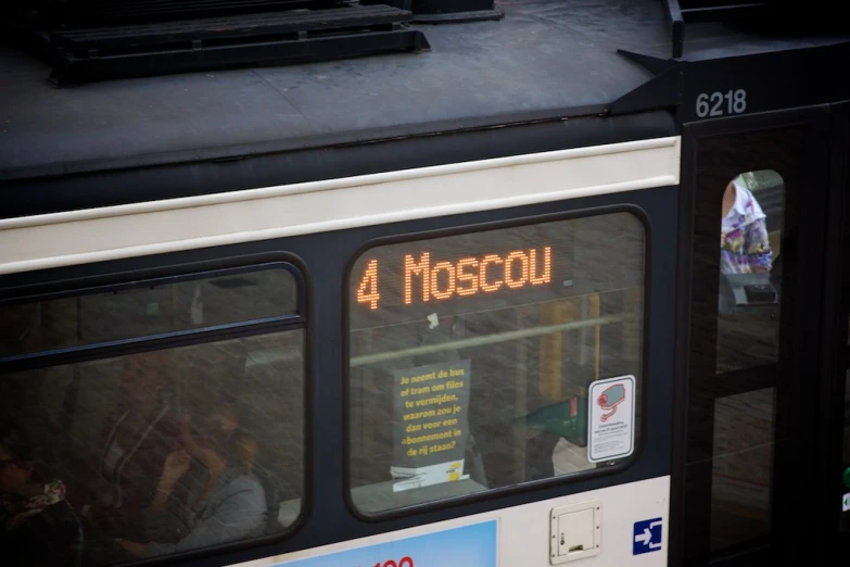 a bus is being led by the 4 moticol sign