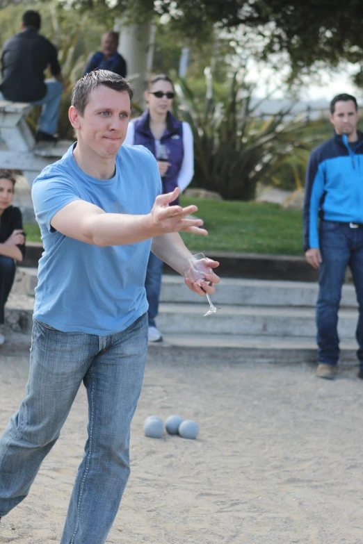 a man is throwing a ball with his arm