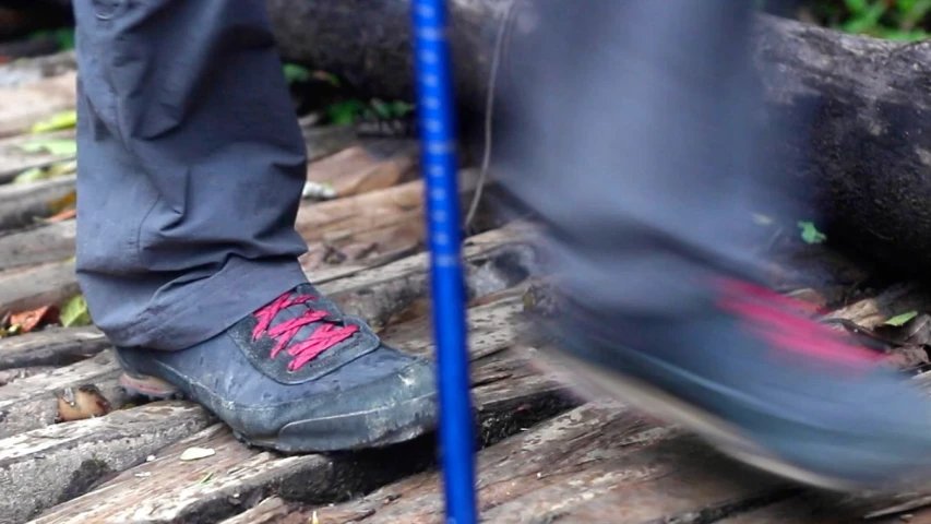 a man is riding on a fallen log