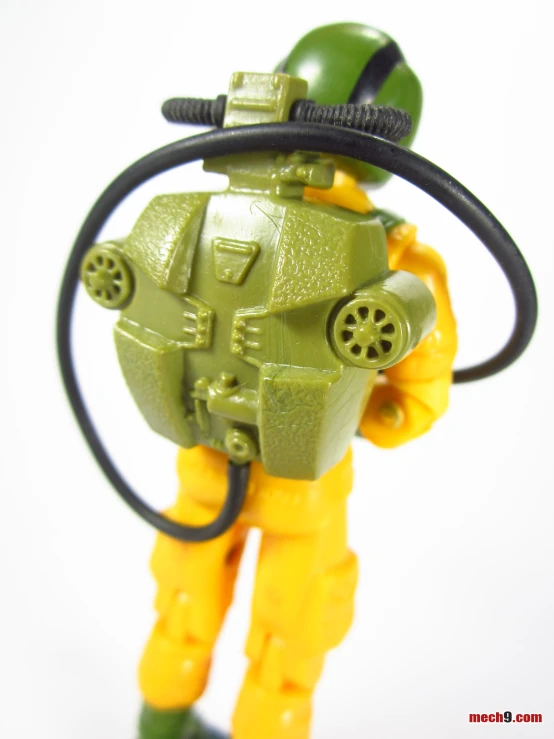 a small plastic action figure wearing a helmet and gas mask
