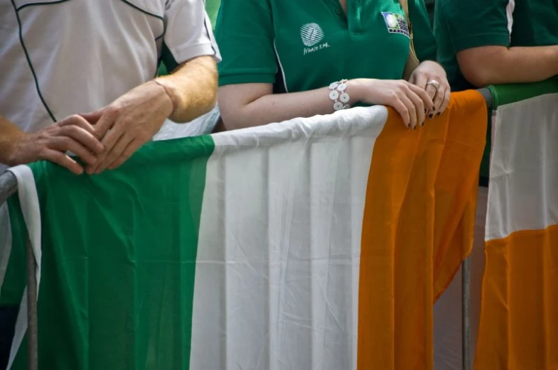 a group of people in sports wear with a flag