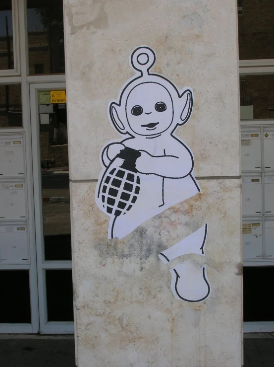 a mural depicting a baby and basketball hoop on the back of a mailbox