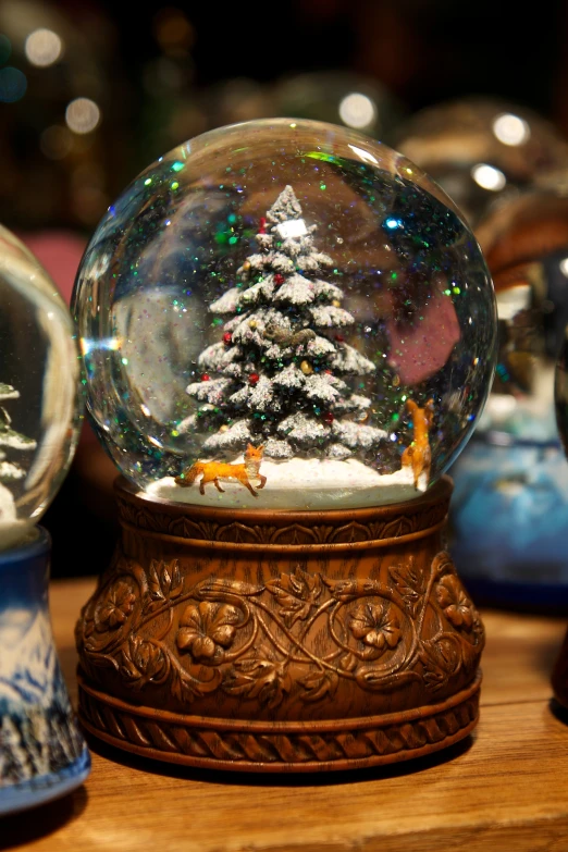 christmas ornaments with a snow globe in the center