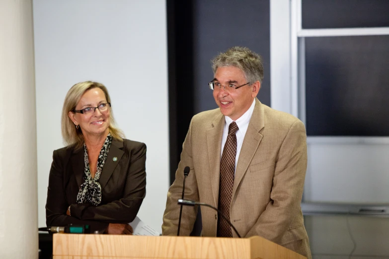 the couple are smiling at an event