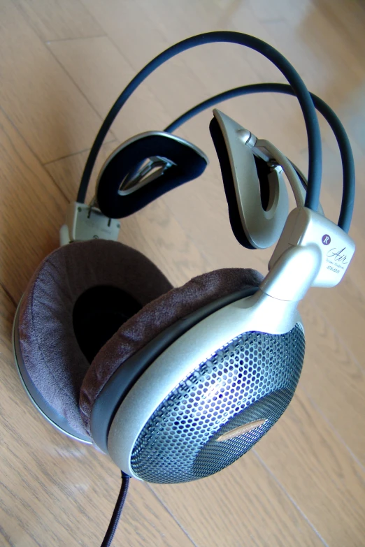 an old pair of headphones sitting on a floor