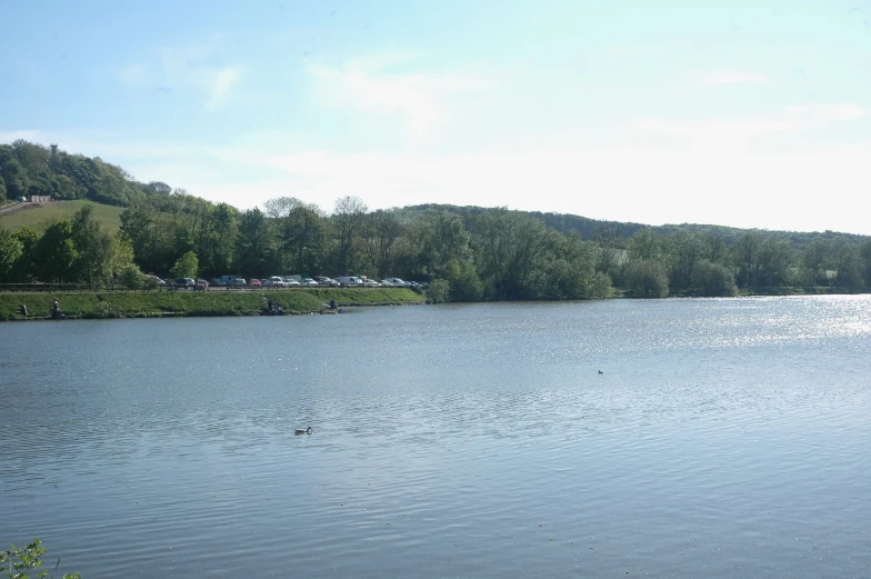 a lake with several small boats floating on it