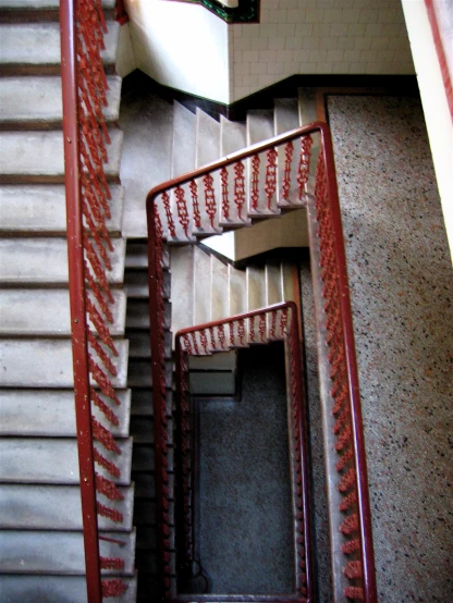 a very long and narrow staircase with hand rails