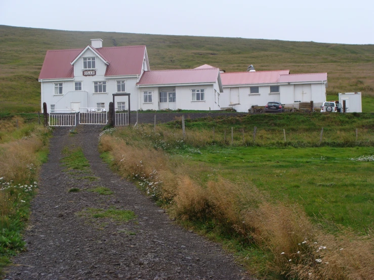 the building in the country has a road in front