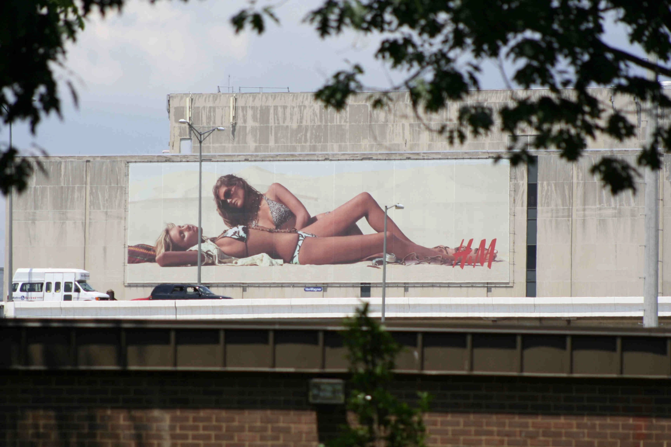 a very tall and very pretty lady on a billboard