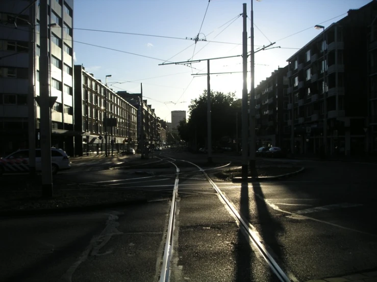 a picture of a street with the sun shining