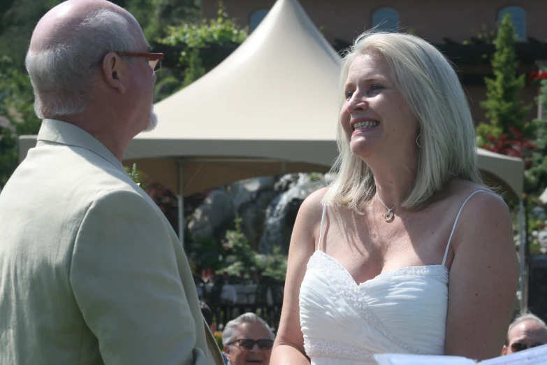 a couple who are standing together at their wedding