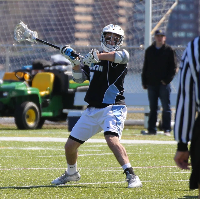 a lacrosse player in action on the field