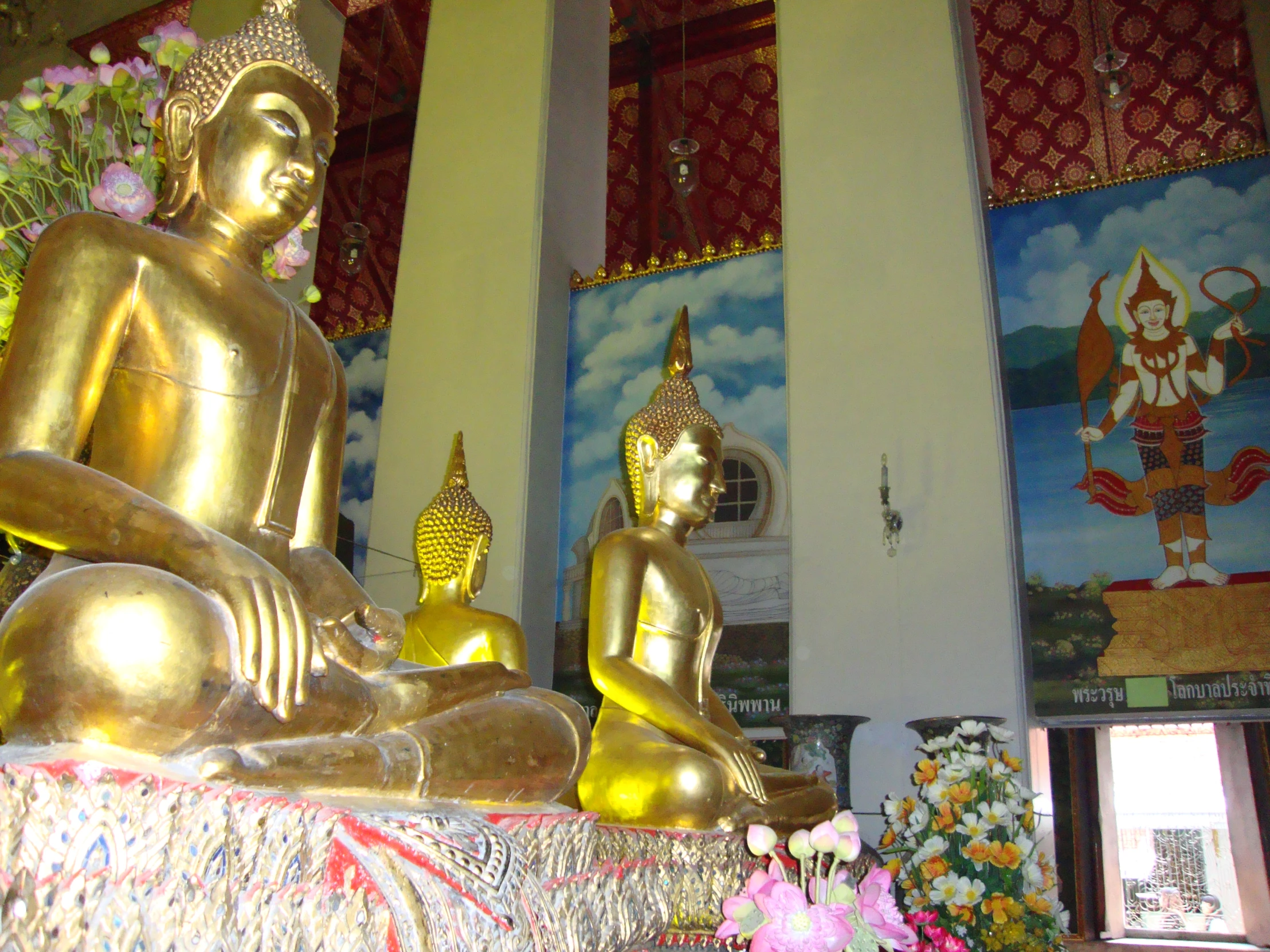 some statues sitting in a room that has multiple different decorations