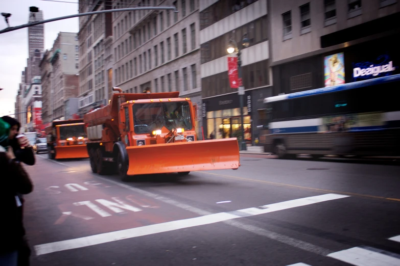 the workers are hing vehicles down the street