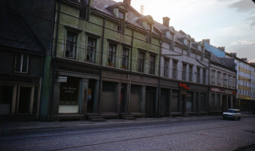 a row of town buildings on a street